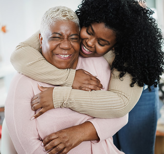 granddaughter embracing grandmother