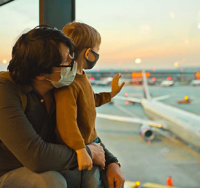 father and son at airport