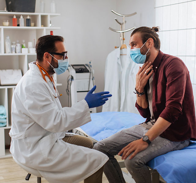 man talking to doctor