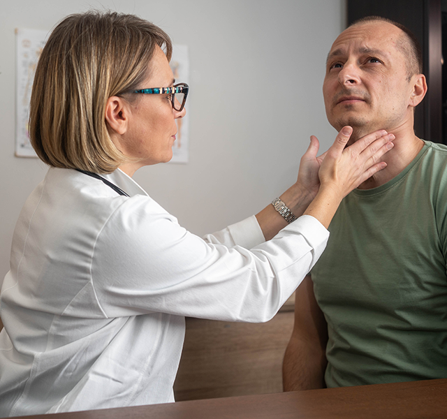 doctor checking thyroid nodules