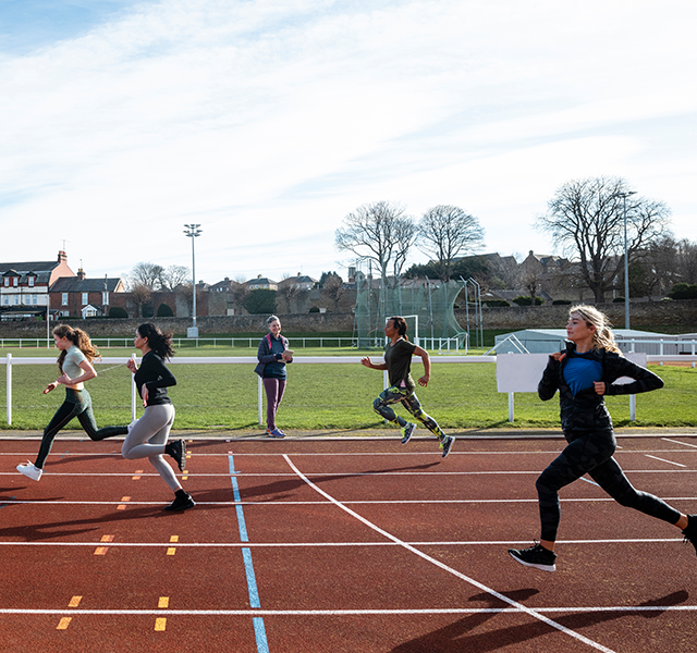 people running on track