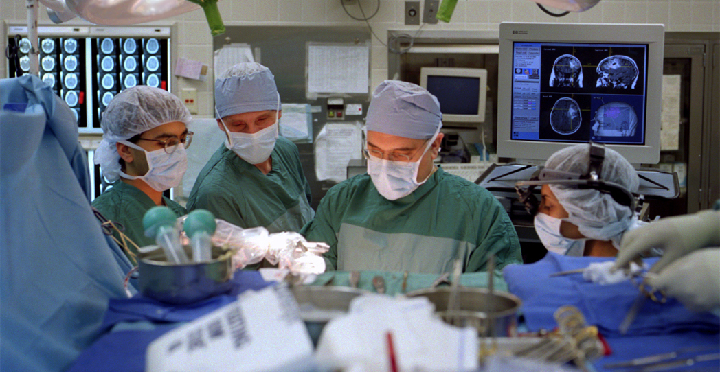 Surgeons in the operating room preforming surgery