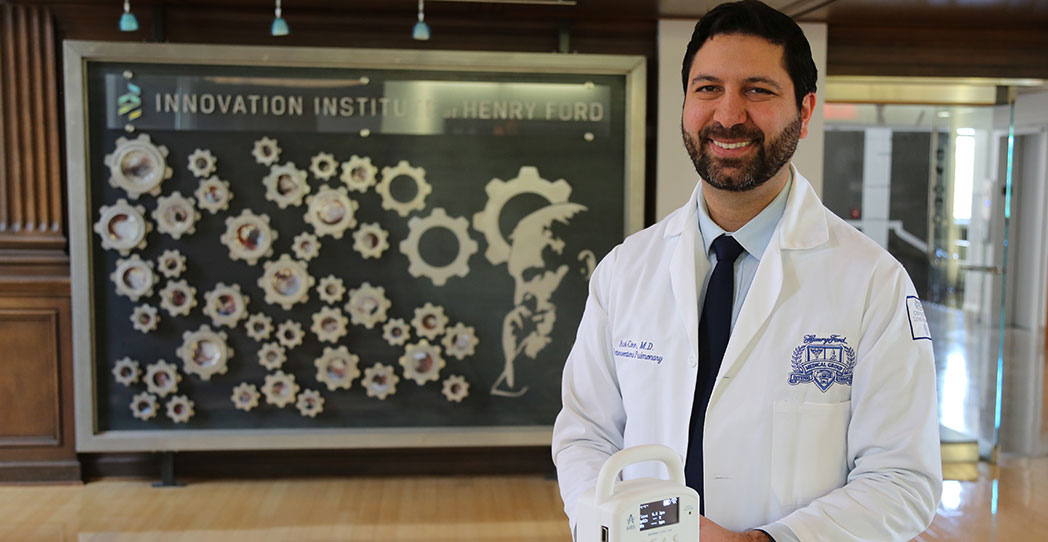 Dr. Avi Cohen with the AIRS respiratory monitoring device