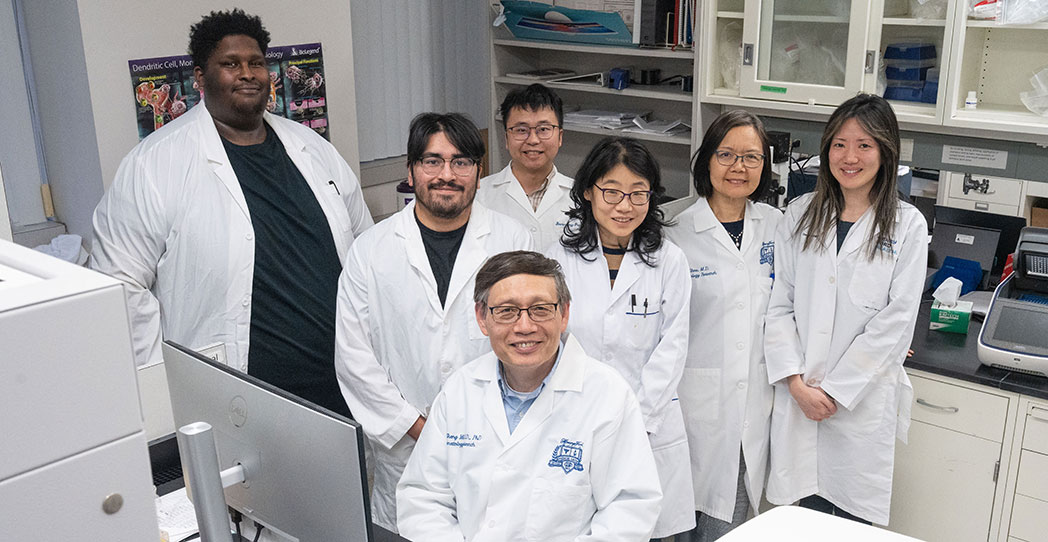 Dr. Mi and his team in the lab