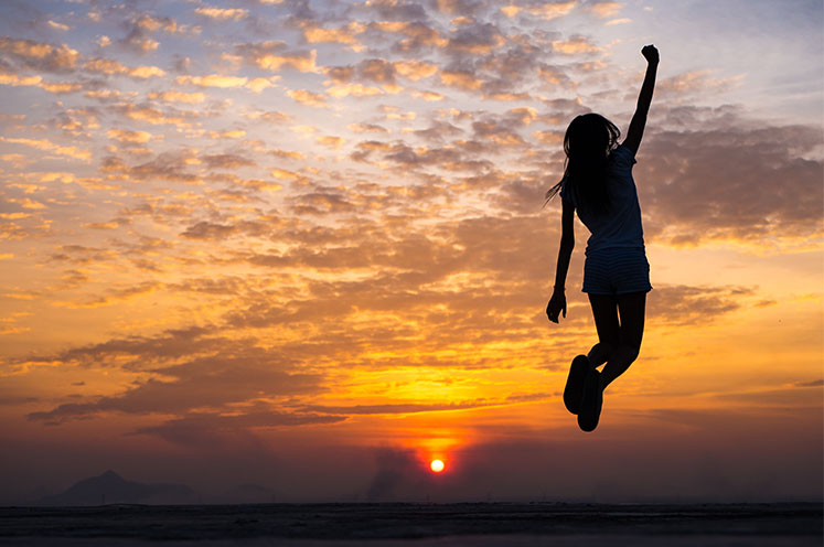 cancer-support-survivor-person-jumping-in-sunrise-cta