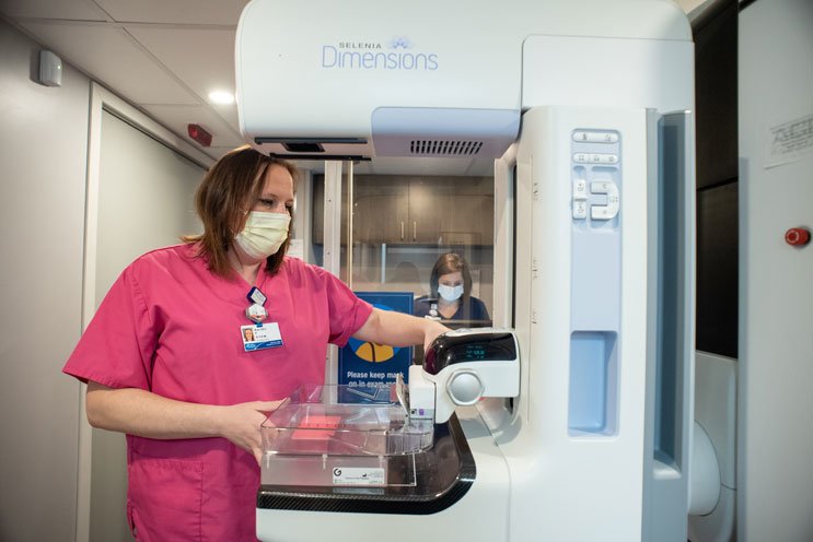 nurse with mammogram machine