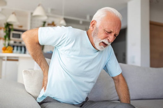 Man holding back in back pain