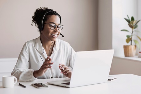 woman using laptop for a virtual meeting