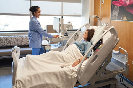 Alliance nurse in a room with a patient
