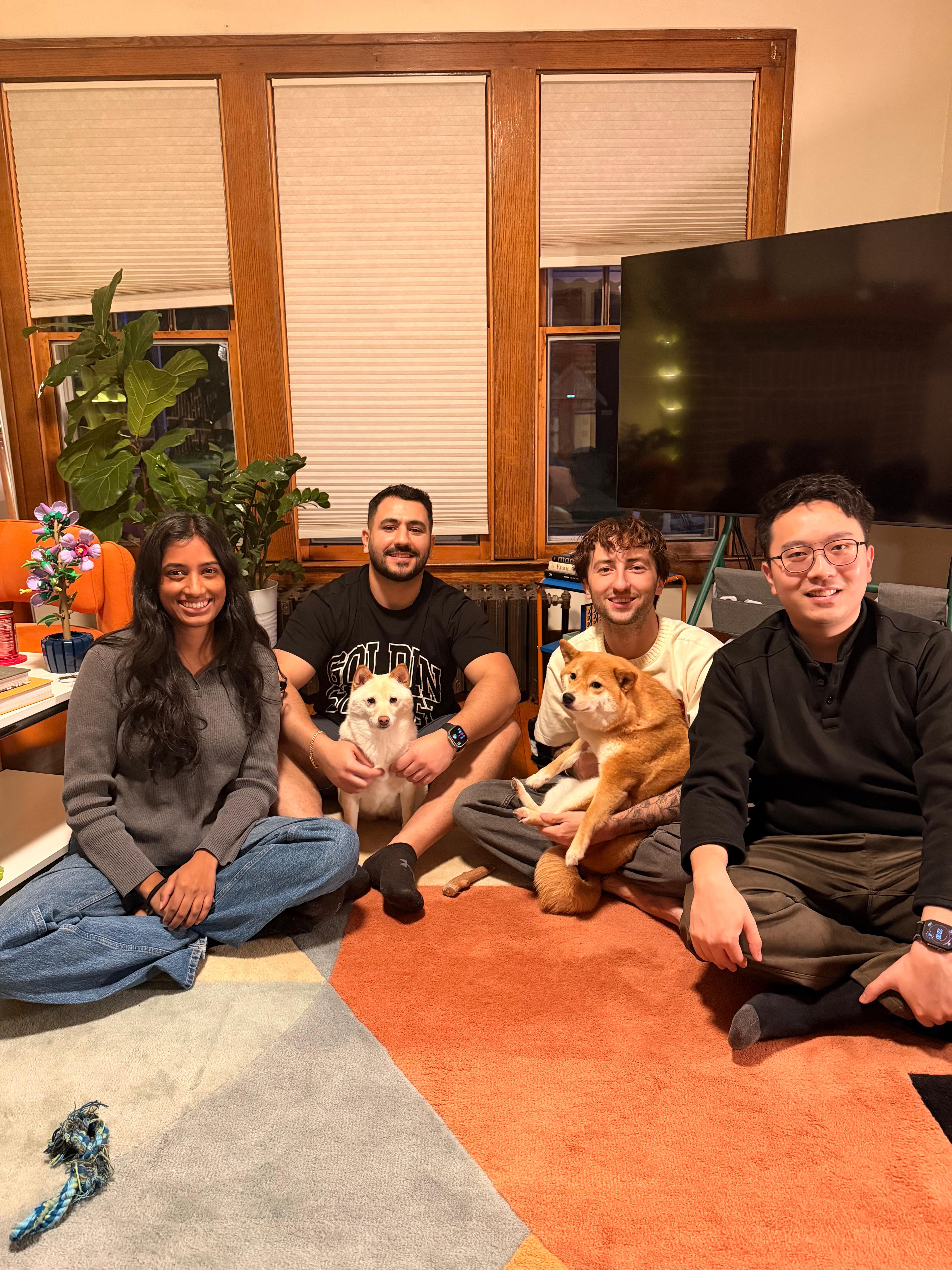 Residents gathered in home with pets.