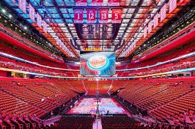 Inside Little Caesars Arena showing the seating and the ice rink