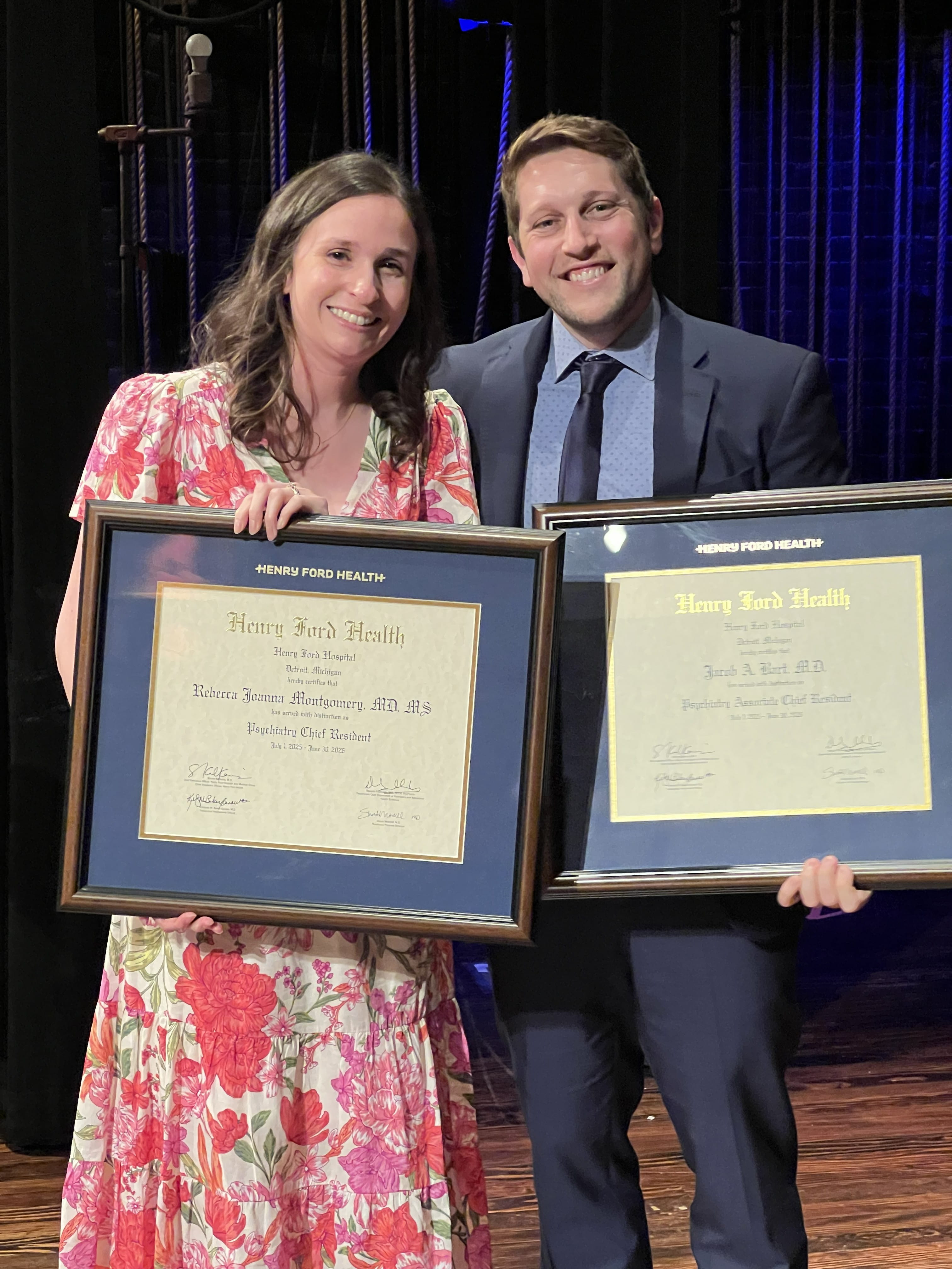 Two graduates posed at Gem Theater
