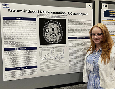 Resident with her poster presentation