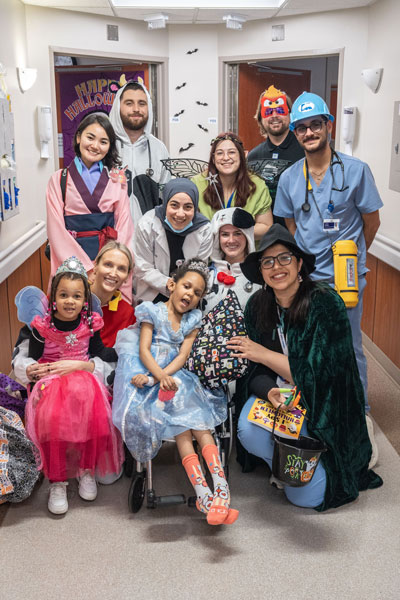 Pediatric residents and patients dressed in Halloween costumes
