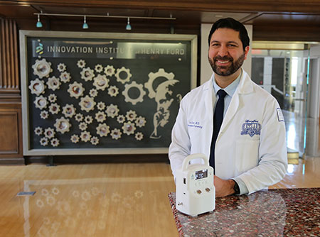 Dr. Avi Cohen with the AIRS respiratory monitoring device