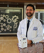 Dr. Avi Cohen with the AIRS respiratory monitoring device