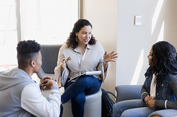 Social worker supporting patient and family