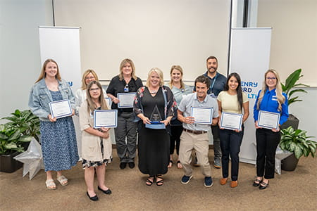 Nursing team holding up awards