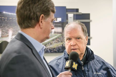 al speaking into microphone