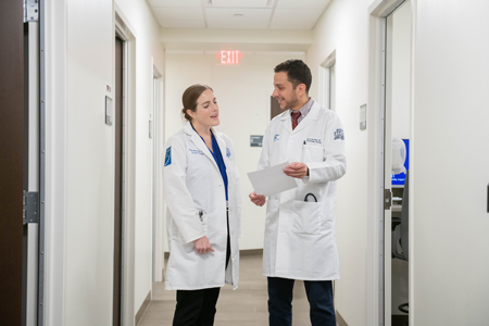 physicians talking in hallway