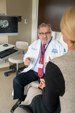 Henry Ford Cancer expert sitting down with patient