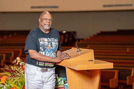 Reverend Anthony posed at the church podium