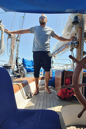 Eric posed outdoors on a boat