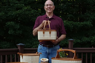 Orthopedic patient Michael showing off baskets