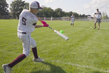 Peirson swinging baseball bat at ball