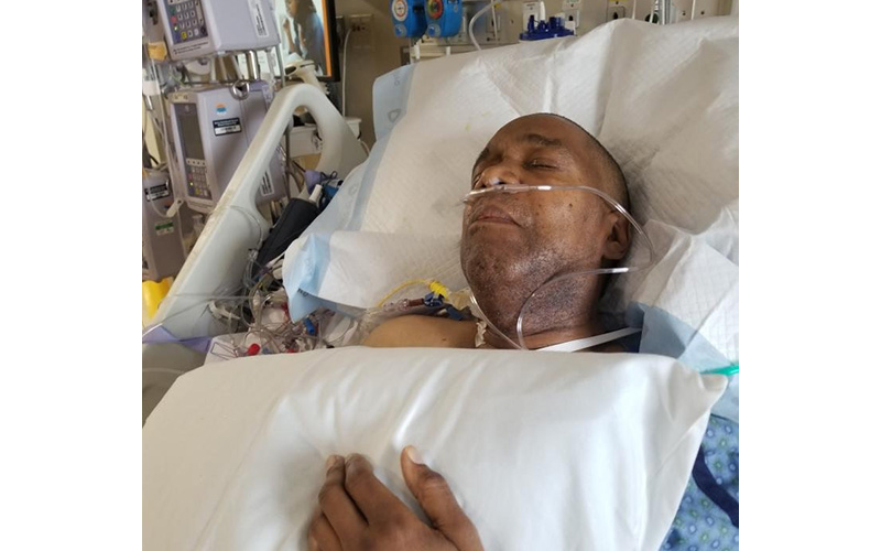 Pulmonary-patient-ken in a hospital bed after surgery