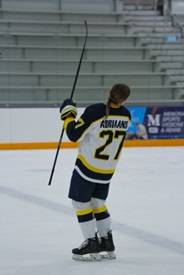 Grace on ice cheering.
