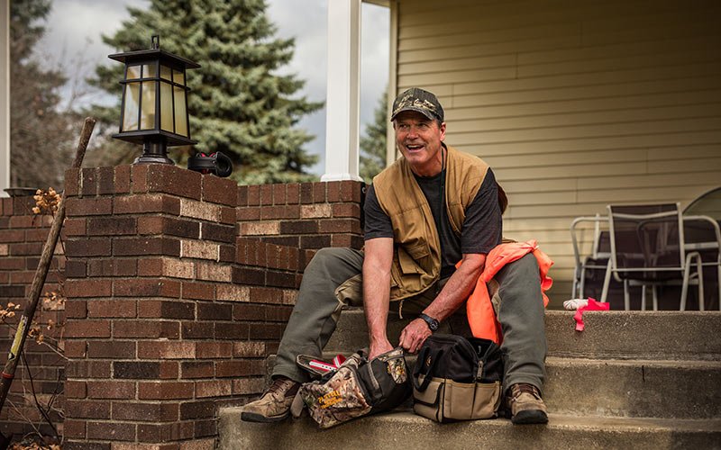 Cancer Patient Jeffrey Clark sitting on his porch