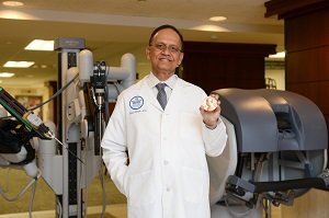 Menon with robot pic resized