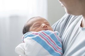 newborn baby being held